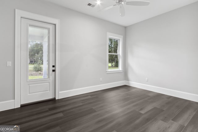 foyer featuring ceiling fan and dark wood-type flooring