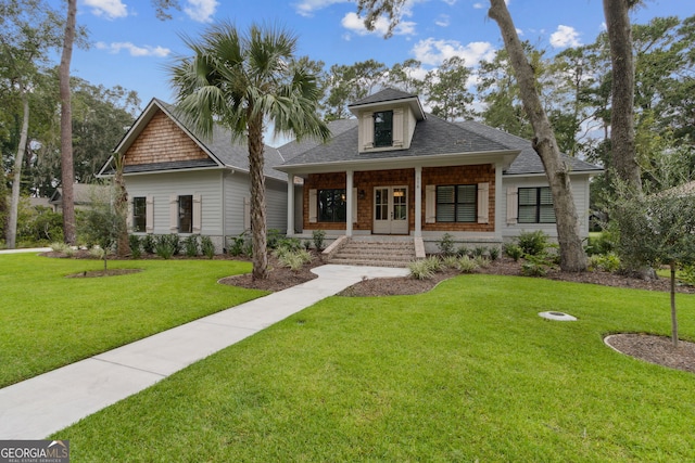 view of front of home featuring covered porch and a front lawn