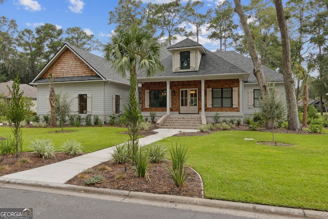 view of front of property featuring a porch and a front yard