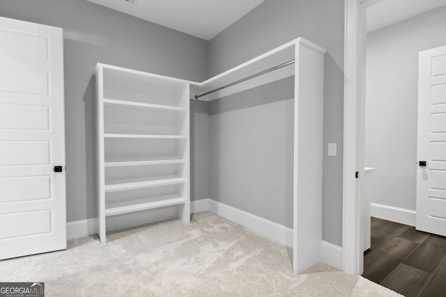 spacious closet featuring hardwood / wood-style floors