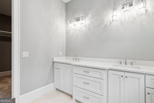 bathroom featuring tile patterned flooring and vanity