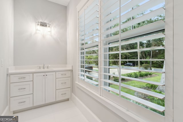 bathroom featuring tile patterned floors, plenty of natural light, and vanity