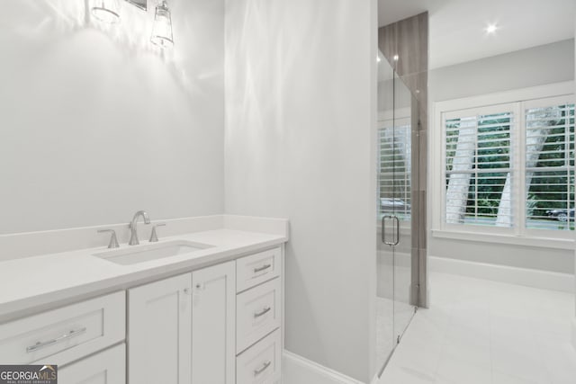 bathroom with vanity and walk in shower