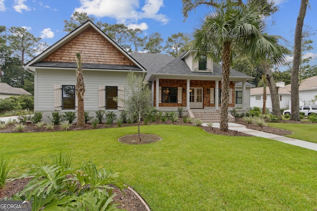 craftsman-style house with a front lawn and a porch