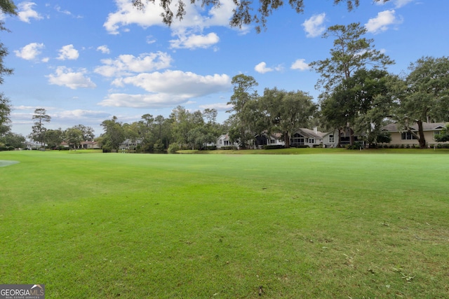 view of home's community featuring a yard