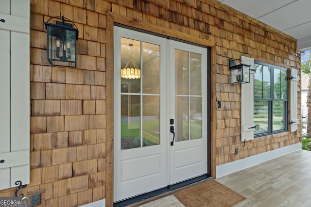 view of exterior entry featuring french doors