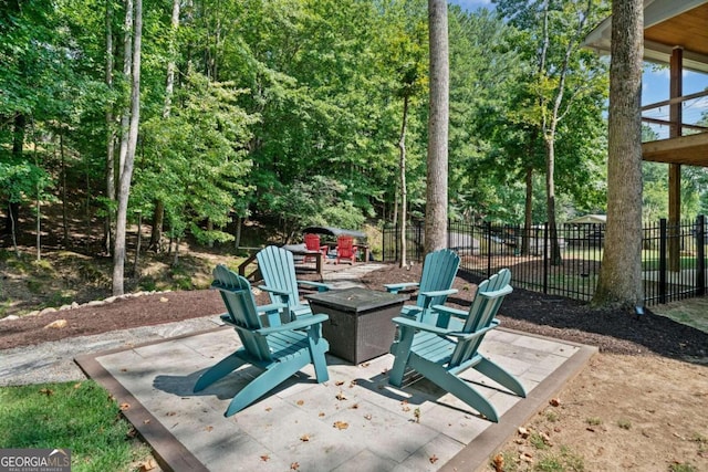 view of patio featuring an outdoor fire pit