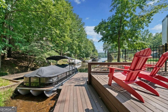 deck featuring a water view and a boat dock