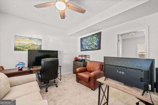 office space featuring light colored carpet and ceiling fan