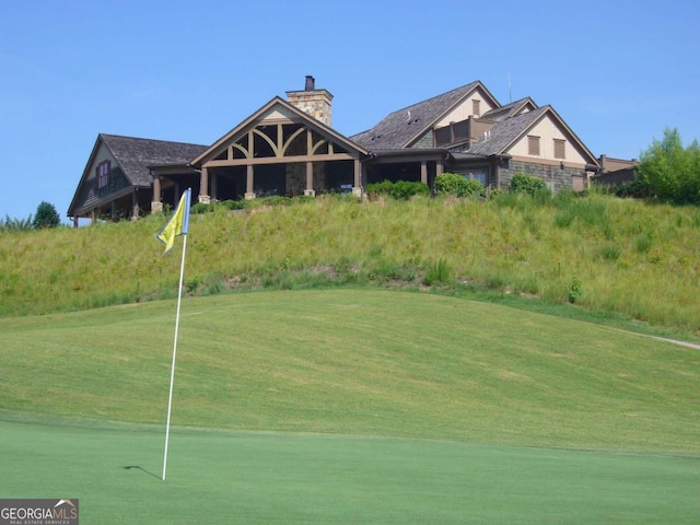 view of property's community with a yard