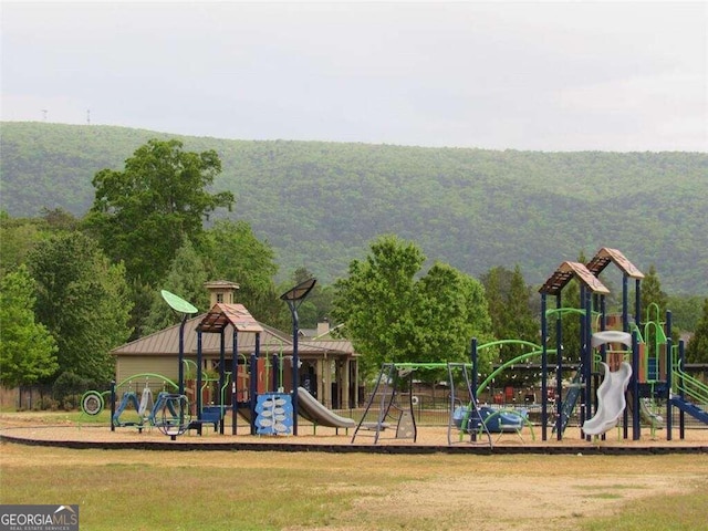 view of playground with a mountain view