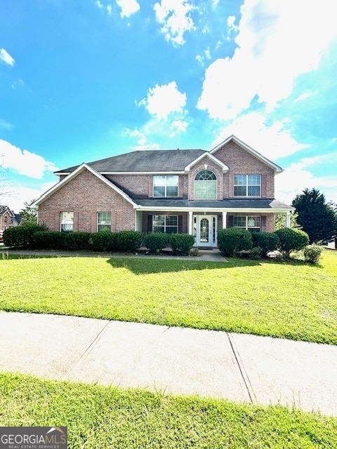 view of front of house with a front lawn