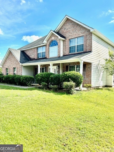 view of front of property with a front lawn