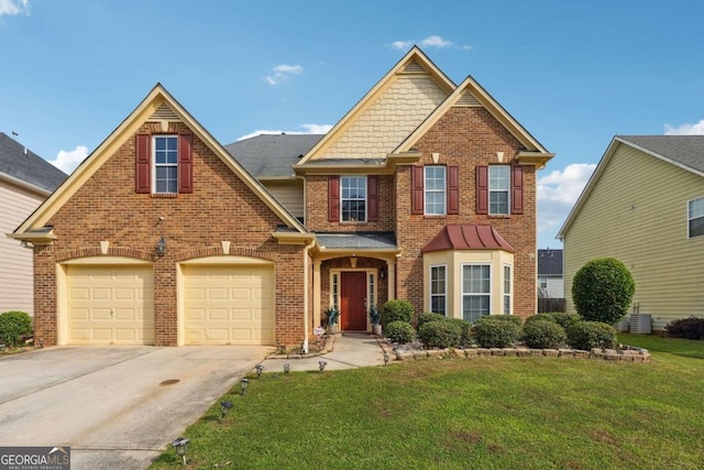 view of front of house featuring a garage and a front yard