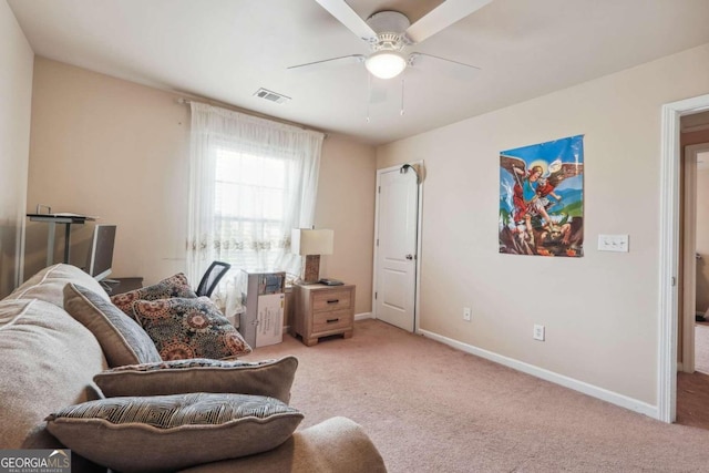 sitting room featuring ceiling fan and carpet