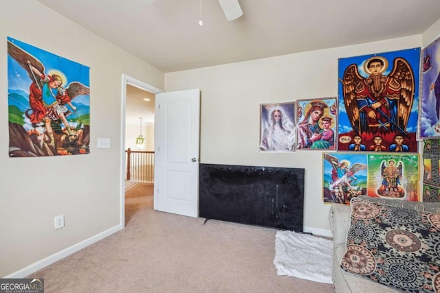 interior space featuring carpet and ceiling fan