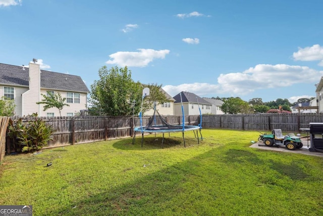 view of yard with a trampoline