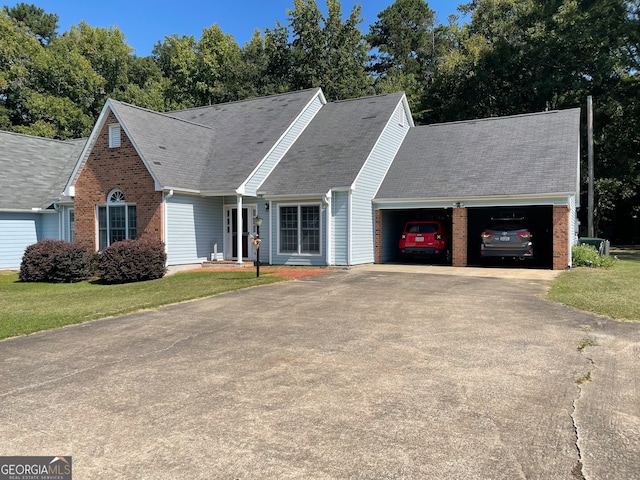 view of front facade featuring a front yard and a garage