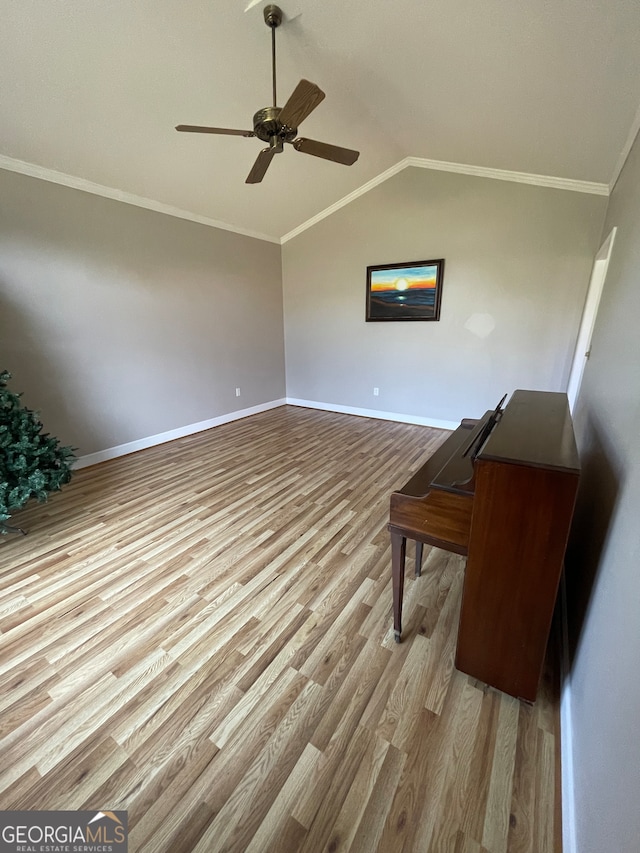 unfurnished living room with lofted ceiling, ceiling fan, crown molding, and wood-type flooring