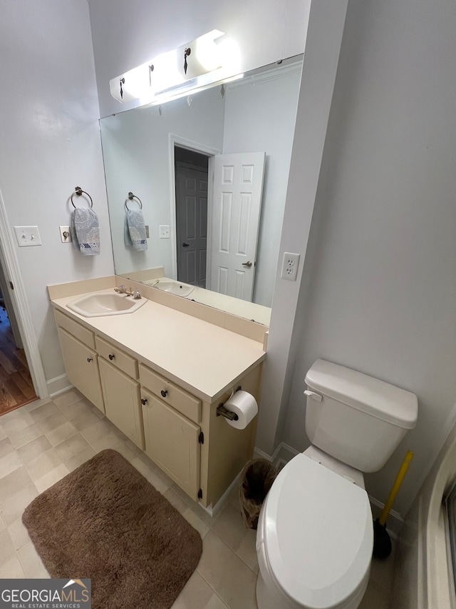 bathroom featuring vanity and toilet