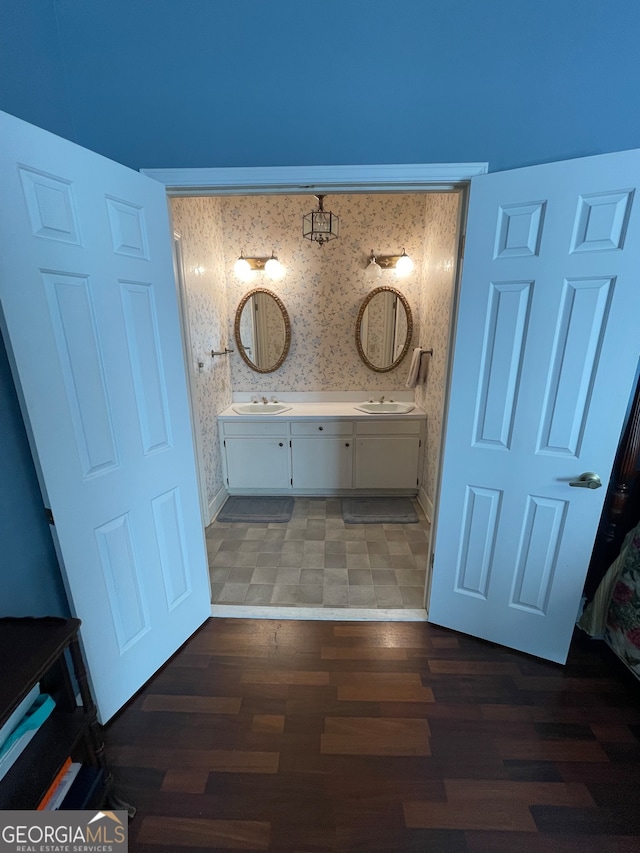 bathroom featuring vanity and hardwood / wood-style floors