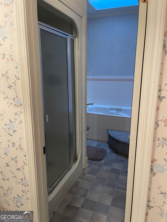 bathroom featuring shower with separate bathtub