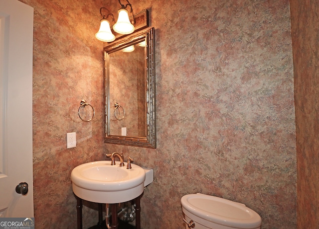 bathroom featuring sink and toilet