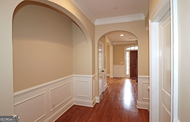 hallway featuring dark hardwood / wood-style flooring and crown molding