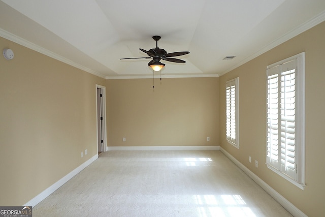 carpeted spare room featuring ceiling fan and ornamental molding