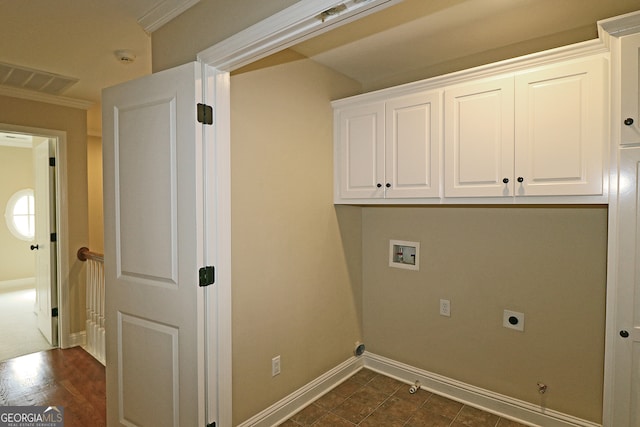 laundry area featuring electric dryer hookup, hookup for a washing machine, cabinets, and ornamental molding