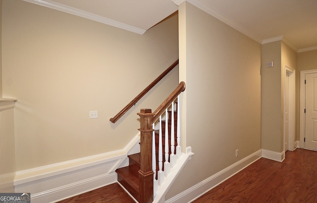 stairway featuring hardwood / wood-style flooring and crown molding