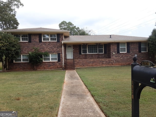 split level home with a front yard