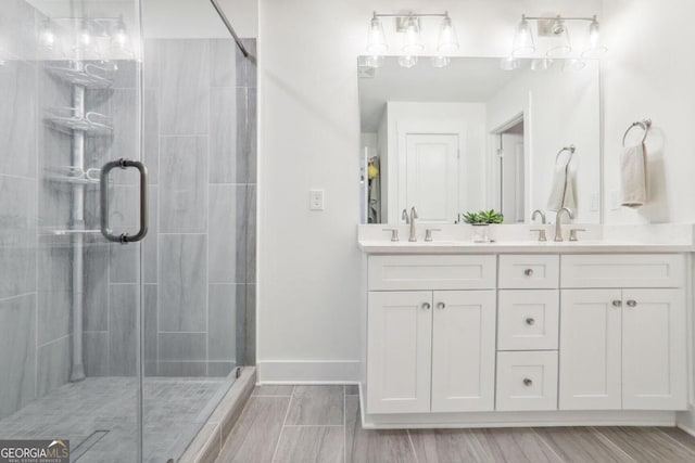 bathroom with vanity and an enclosed shower