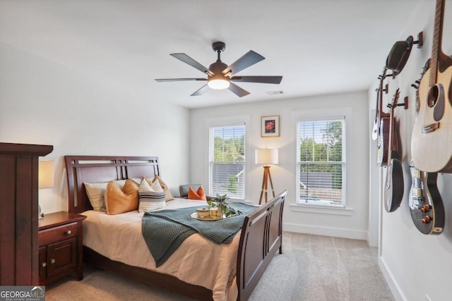 carpeted bedroom with ceiling fan