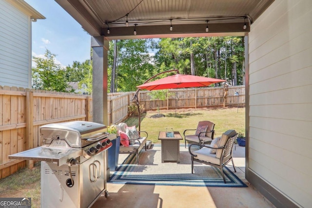 view of patio featuring a grill