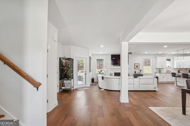 foyer with hardwood / wood-style floors and sink