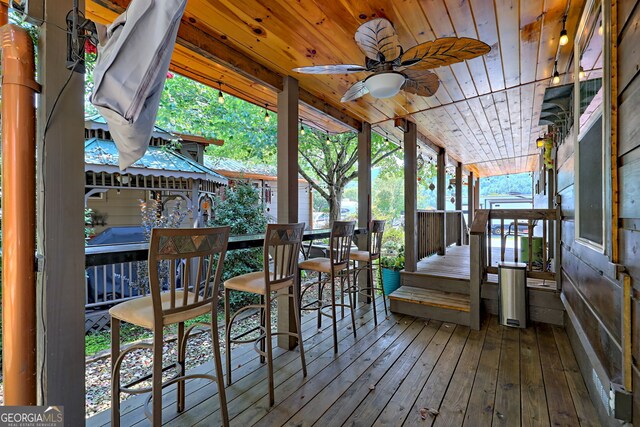 wooden terrace with ceiling fan