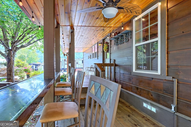 exterior space featuring ceiling fan