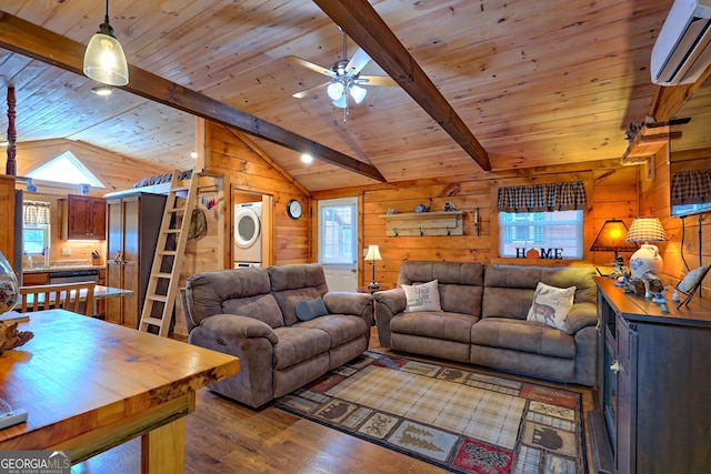 living room featuring hardwood / wood-style floors, stacked washer and dryer, wooden walls, ceiling fan, and lofted ceiling with beams