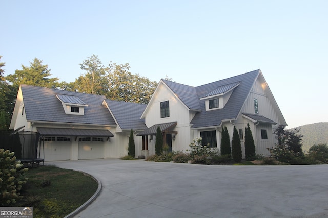 modern inspired farmhouse with a garage