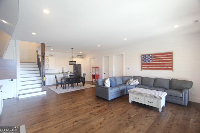 living room with dark hardwood / wood-style floors