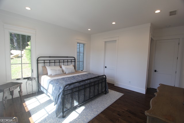 bedroom featuring dark wood-type flooring