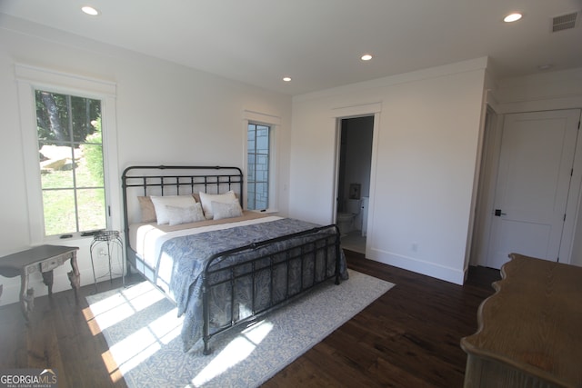 bedroom featuring dark hardwood / wood-style floors