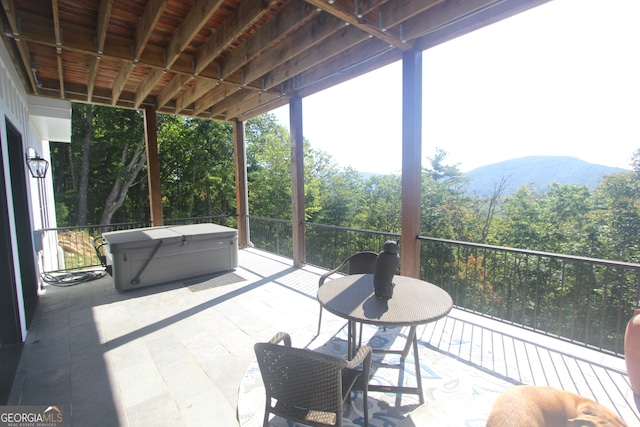 view of patio / terrace featuring a balcony and a mountain view