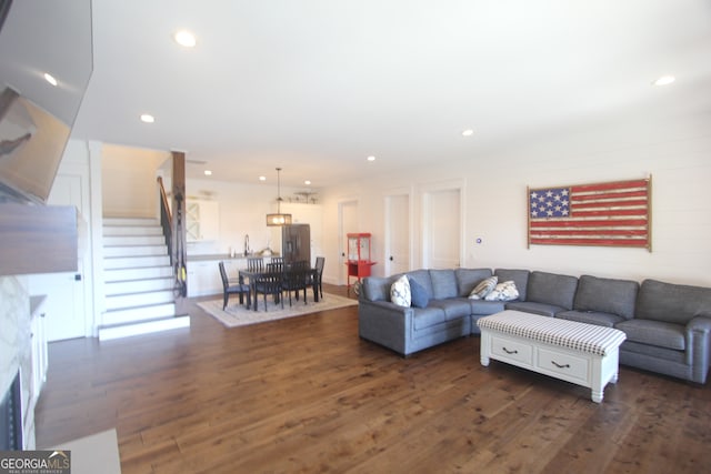 living room featuring dark wood-type flooring