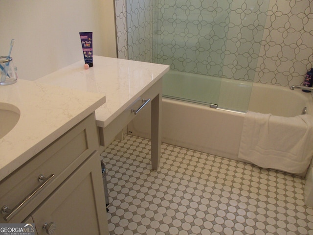 bathroom with shower / bath combination with glass door and vanity