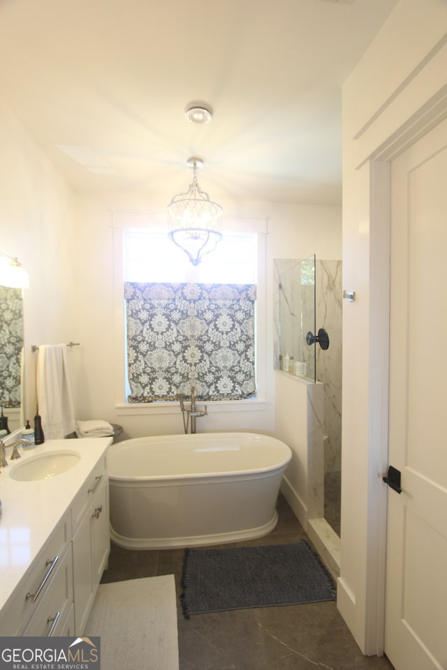 bathroom featuring vanity, separate shower and tub, and tile patterned floors