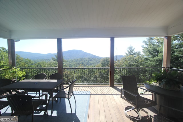 wooden deck with a mountain view