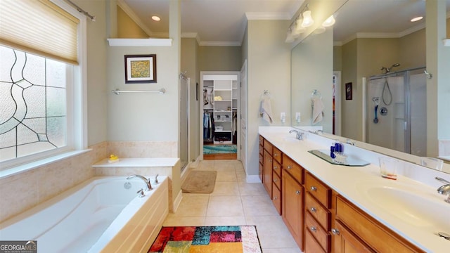 bathroom with vanity, a healthy amount of sunlight, tile patterned floors, and separate shower and tub