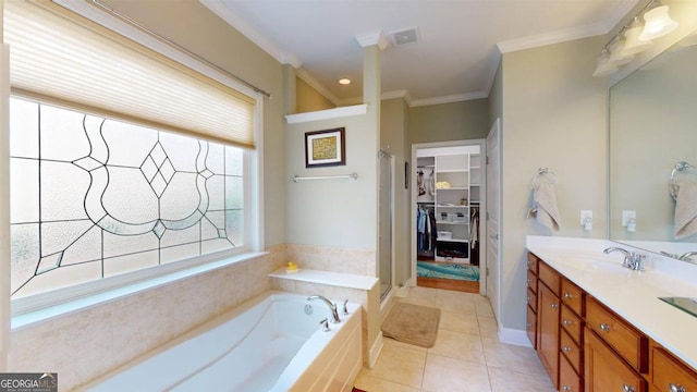 bathroom with tile patterned floors, separate shower and tub, crown molding, and vanity